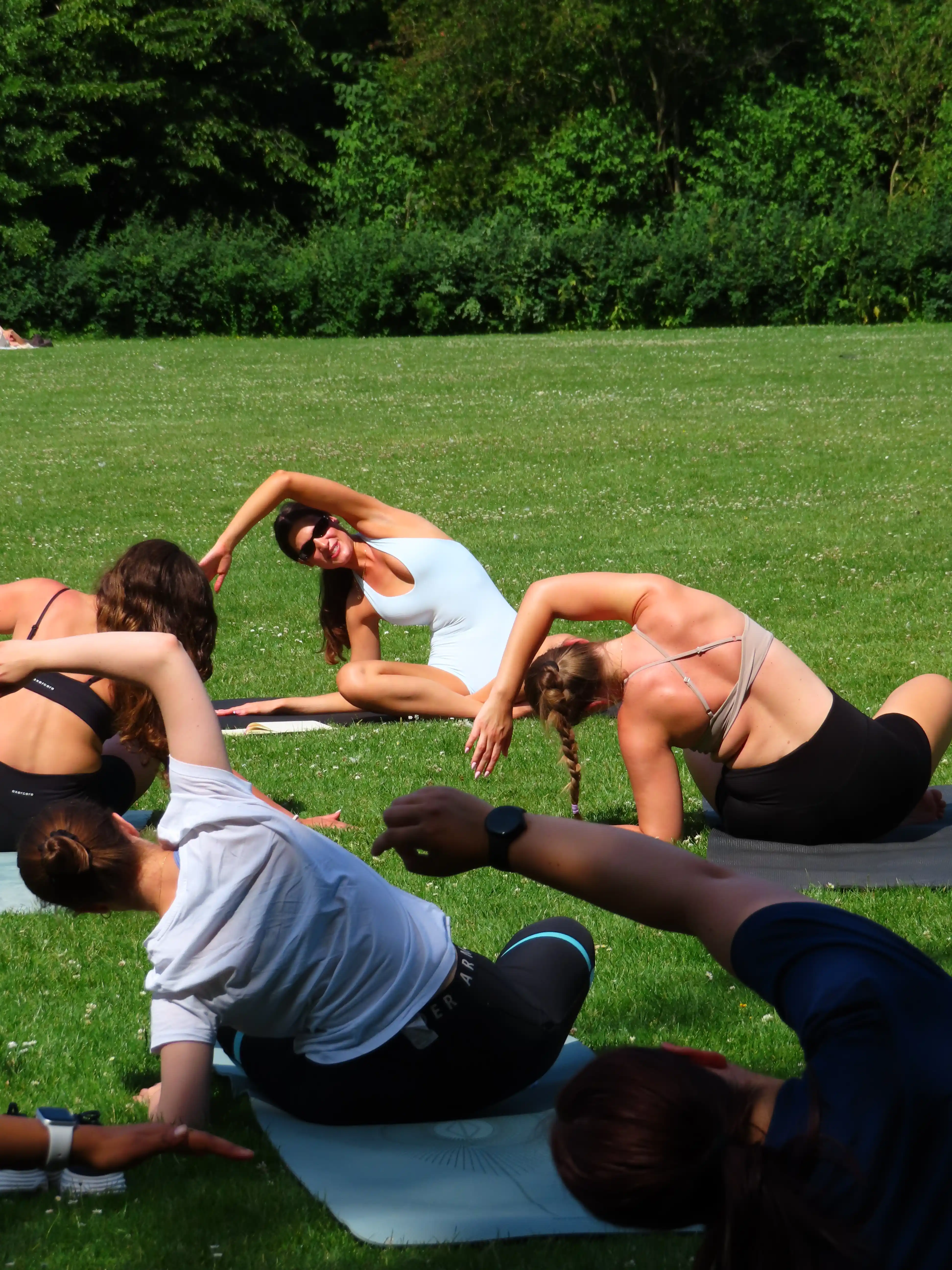A small Forma Pilates class outdoors.